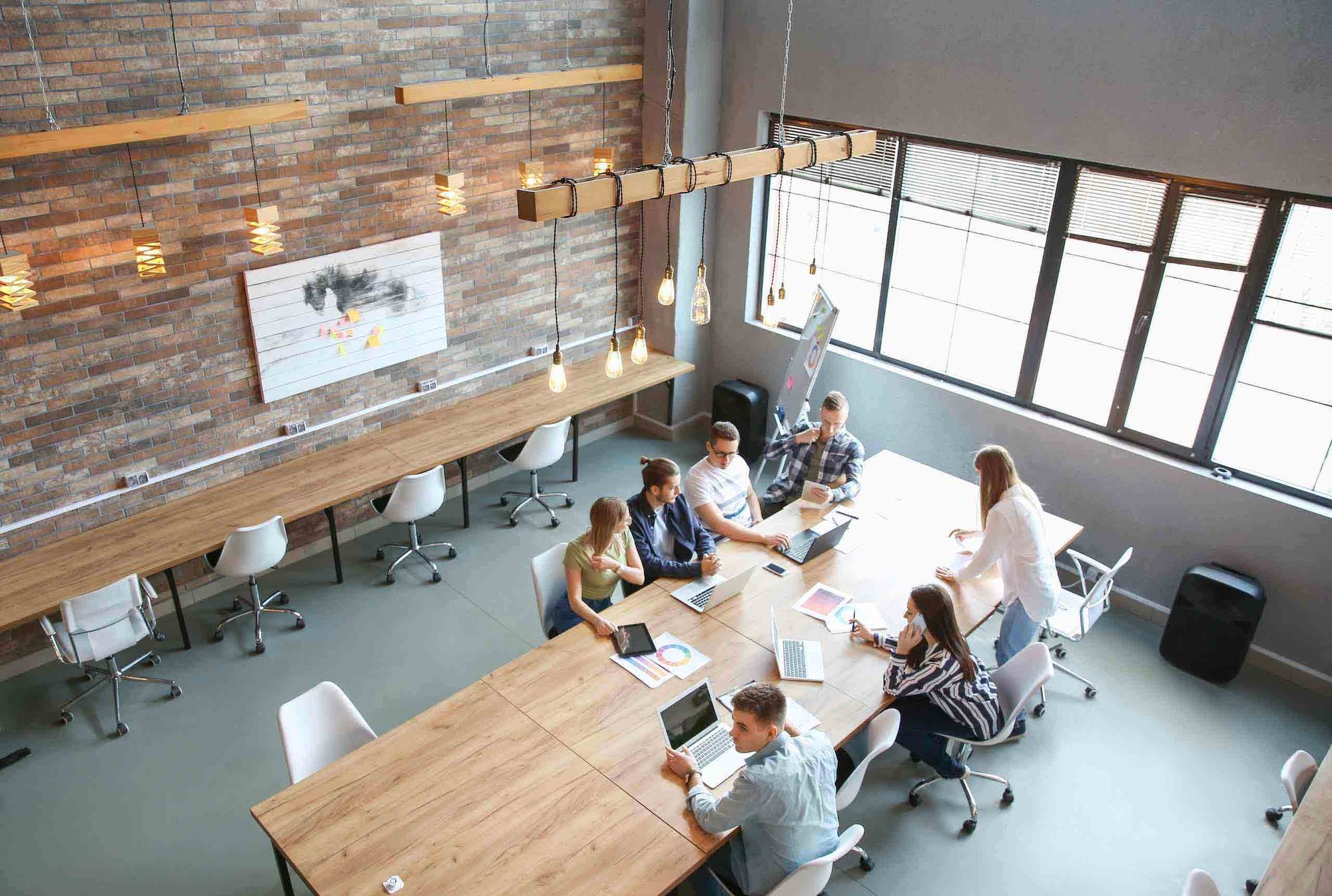 High angle view of a team of workers in an open-plan office environment.